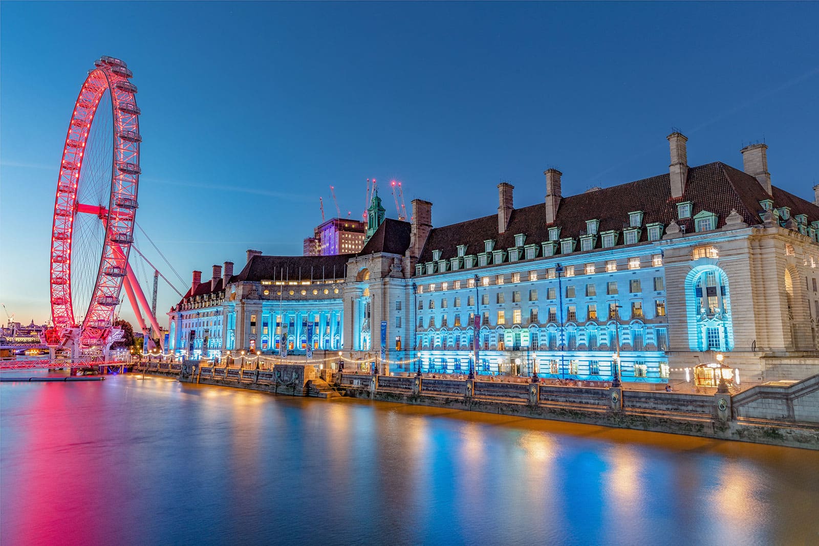 A hotel room with panoramic views of the River Thames and Big Ben.